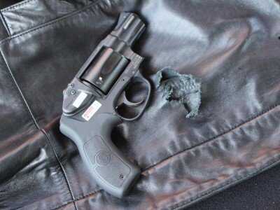 Shooting Revolvers and Autos From the Pocket The perfect pocket pistol? At least for firing from inside a coat. This Smith has a laser, too--though it doesn't do you much good inside the pocket.