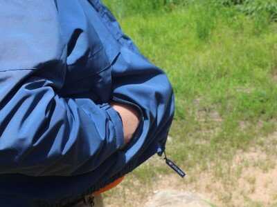 Shooting Revolvers and Autos From the Pocket The nylon coat offered nice concealment, and the gun poked through the hole easily for better follow-up shots.