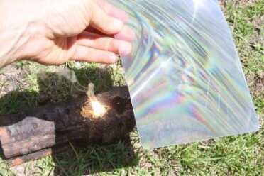 Prepping 101: Starting Fires with Sparks and the Sun Starting the Fatwood with the Freznel sheet.