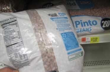 Prepping 101: Survival Food by the Numbers - It's About Calories Silly! Pinto Beans have 23,310 calories per 20 lb. bag. It costs $13.97 at Walmart. That equals 1669 calories per dollar. You should always soak and cook beans well, because it will make them easier to digest. Mixing them with oils also helps.
