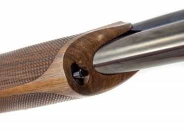 Benelli 828U--The Future of the Over-Under Shotgun The fore-end stock is removed by a push button that's out of the way of your support hand.