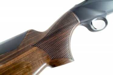 Benelli 828U--The Future of the Over-Under Shotgun The checkering pattern on the grip and fore-end stock resembles scales - another non-traditional approach.