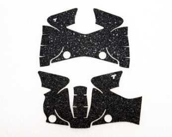 A Visit to Talon Grips No, it's not a "Rorschach" test - but the before and after of the M&P Shield grip pattern. The newly redesigned grip (bottom) is more intricate. We’re not qualified to help you if you see something else.
