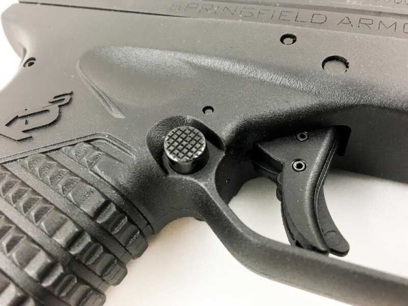 The magazine release button is present on both sides - no need to swap it from left to right.