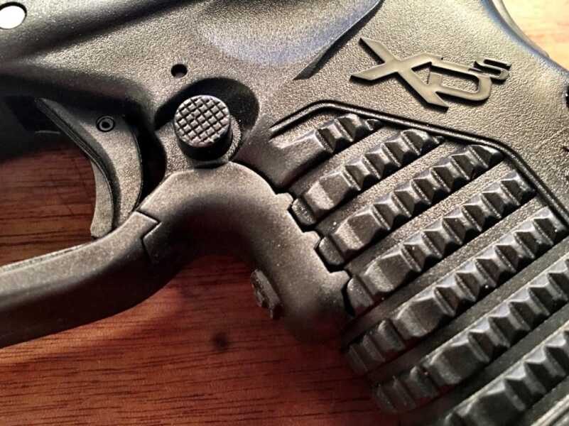The Crimson Trace Laserguard is designed specifically for the XD-S. Note how the activation button integrates with the grip texture.