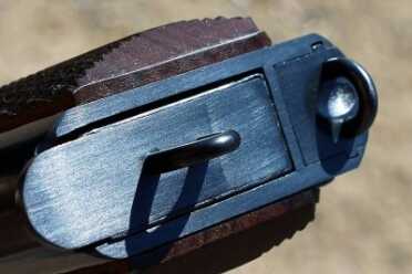Loops on the bottom of the mag and the gun for leashing. 