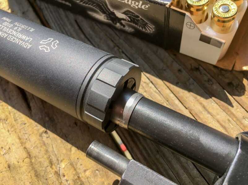 The Illusion is installed "upside down" here, but if installed correctly on this Beretta 92, the guide rod would just barely hit the suppressor body. Get the right booster piston to solve that.