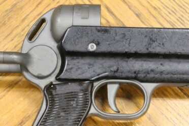 The Legacy of the MP40--Full Auto Review Simple construction of stock to reduce cost over MP 38.
