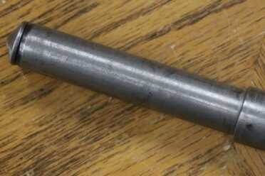 The Legacy of the MP40--Full Auto Review Rear of tube used to in blowback operated bolt/recoil system.