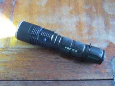 Factor LED Flashlights -- Review You can see the blue light indicator that the flashlight needs to be charged.