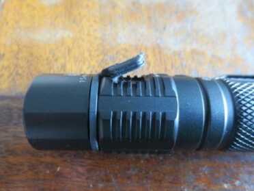 Factor LED Flashlights -- Review The rubber flap to the rechargeable USB port.