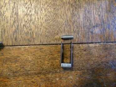 A close up of the stirrup and pin. 