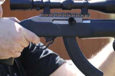 Customized Rimfire For Fighting Dangerous Domestic Terrorists! With a high-power optic, extended magazine and commitment to defend our nation, the author is ready.