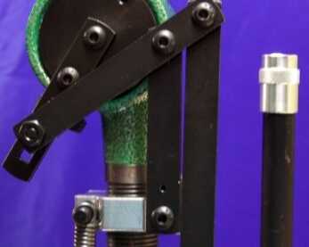 RCBS Pro-Chucker 7: Part 1 – Setup and First Operation The linkage that operates the powder dispenser ensures a consistent charge every time. To the right is the primer feeding tube.