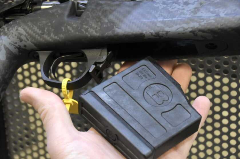 Bergara Has Three New Rifles -- SHOT Show 2023 A black rifle magazine lays in a man's hand.
