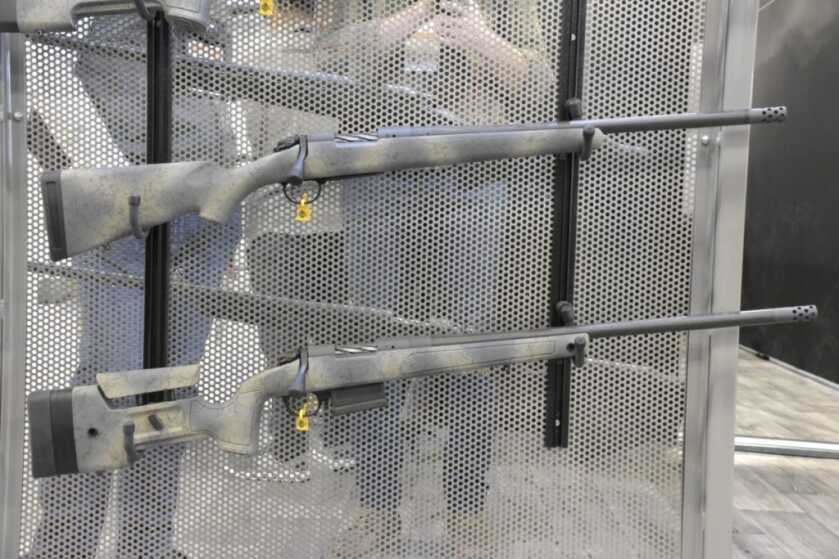 Bergara Has Three New Rifles -- SHOT Show 2023 two rifles hanging on a metal panel.