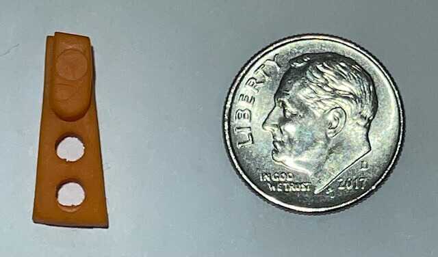 The Stacker: The Next New Thing for Better Pistol Shooting? The Stacker shown next to a dime