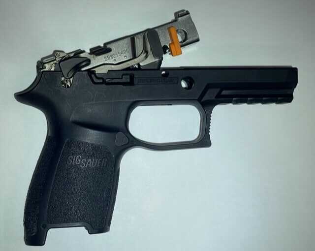 The Stacker: The Next New Thing for Better Pistol Shooting? Stacker on the P320 pistol fire control unit.