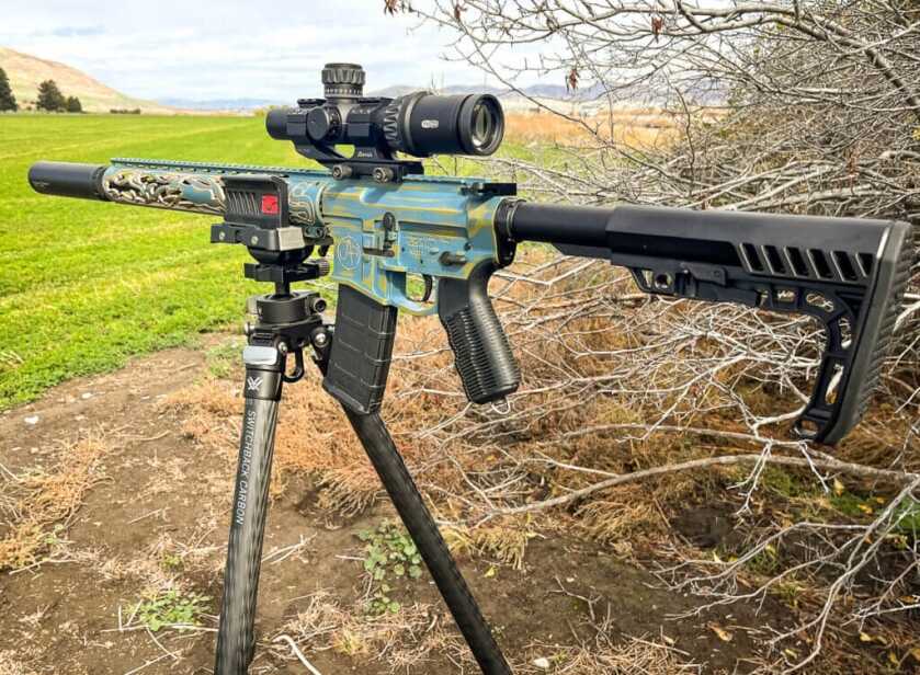 3 - Hunt 365 - Simple Gourmet: Badger Potstickers & Badger Hunting Gorgeous blue and gold long rifle on Vortex Switchback Carbon tripod outside