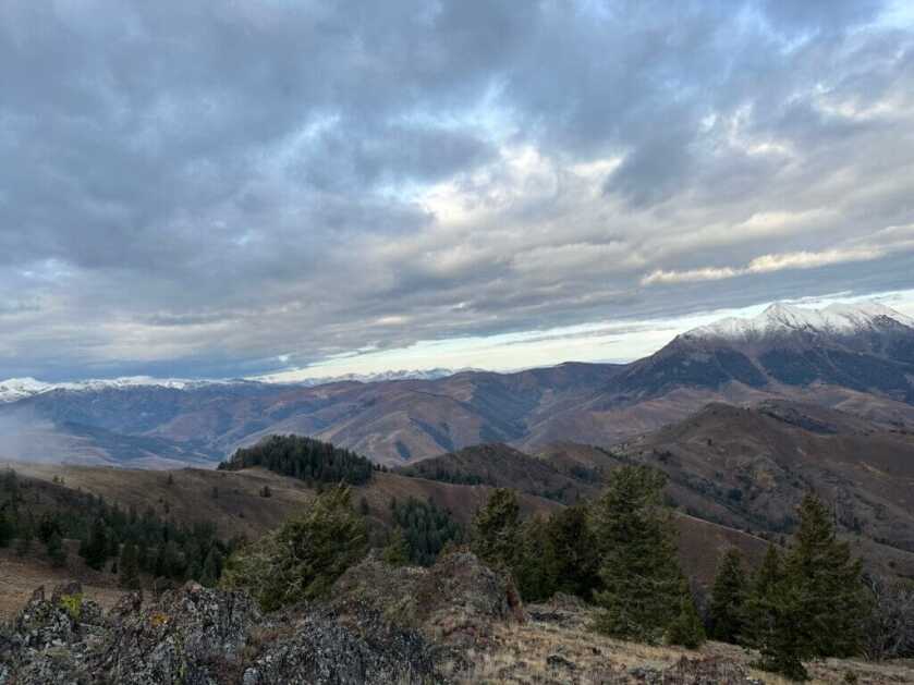 3 - Fireside Stories: How I Killed My Smallest Bull Elk on The Best Tag I've Ever Had - Part 3 of 3 A scenic view of the mountains as hunters continue their search