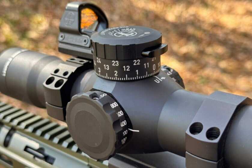 Push button for unlocking the turret sitting top center of the elevation cap