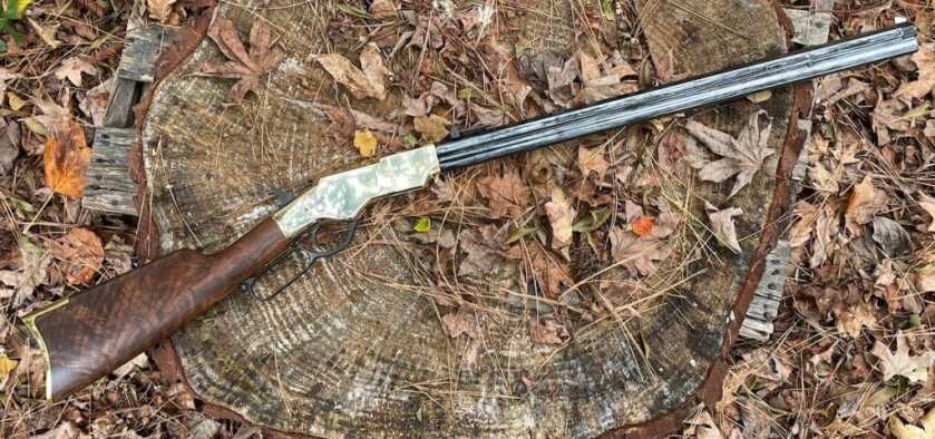 3 - Hunt365 - The New Original Henry In Hunt Camp New Original Henry rifle resting on a rustic tree stump