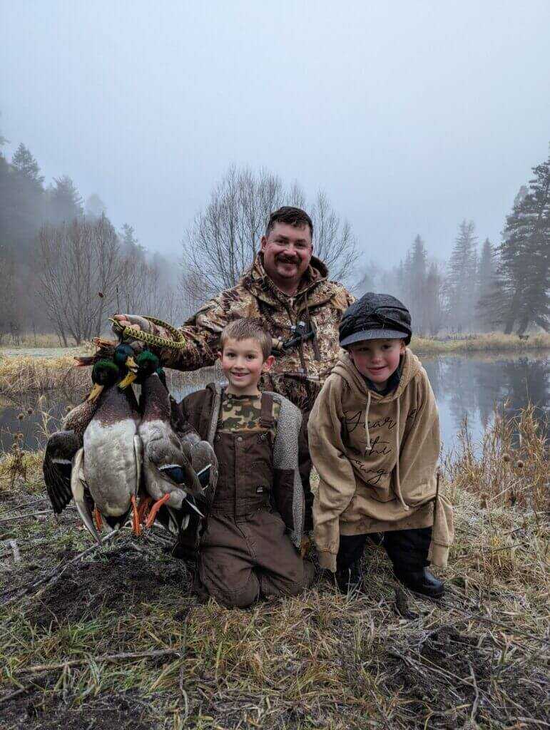 3-December-Kryptek Flyway Deadzone Review Hunter with two kids and a handful of ducks