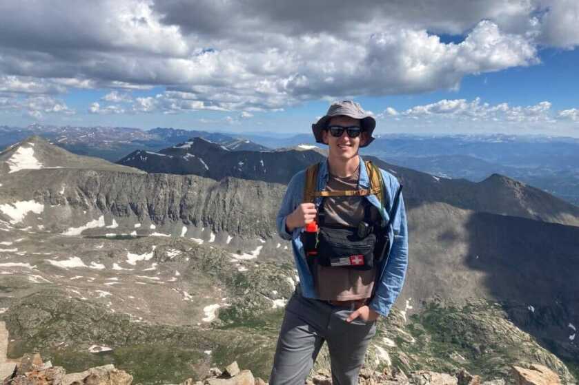 Shooter standing on mountain 