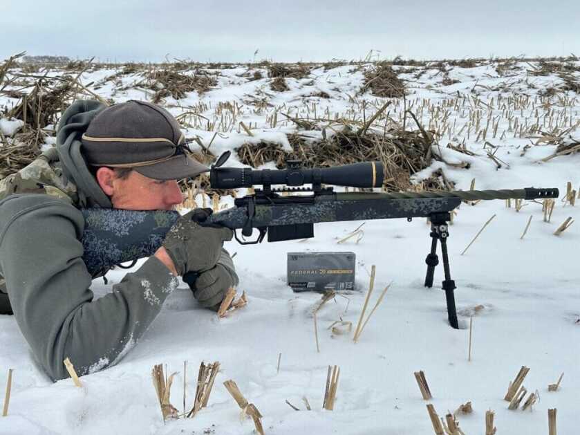man shooting rifle