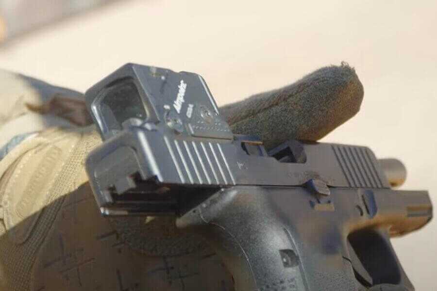 A COA mounted on the Glock.