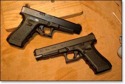 The Gen 4 (Glock 35 Gen 4 bottom, next to Gen 3 Glock 35, above) has added a new twist to the Glock pistol line. Notice the duller look of the newer finish for Glock pistols on the Gen 4 pistol. 