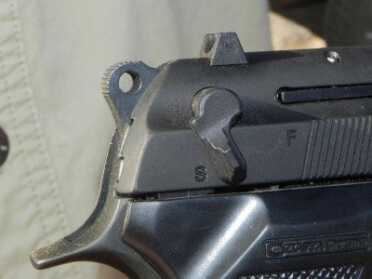 Controls include a safety lever with “safe” and “fire” positions. Flipping the lever to the safe position also decocks the hammer.