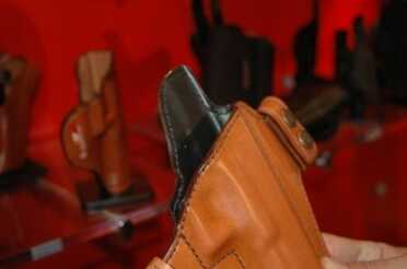 The Consent holster (model 125) is an open top holster. Notice the inner shell of synthetic of the holster on the Consent.