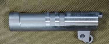 Close-up of the 11-degree muzzle crown, and traditional barrel lugs.