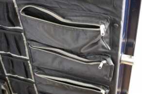 A hanging organizer like this on the back of the safe’s door insures that no space is wasted. 