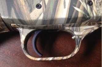 I was able to get a gloved finger in the trigger guard without any problems. It’s not what I would call oversized though. 