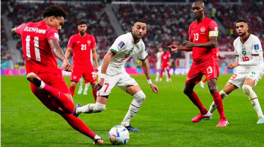 Soccer players in orange and white