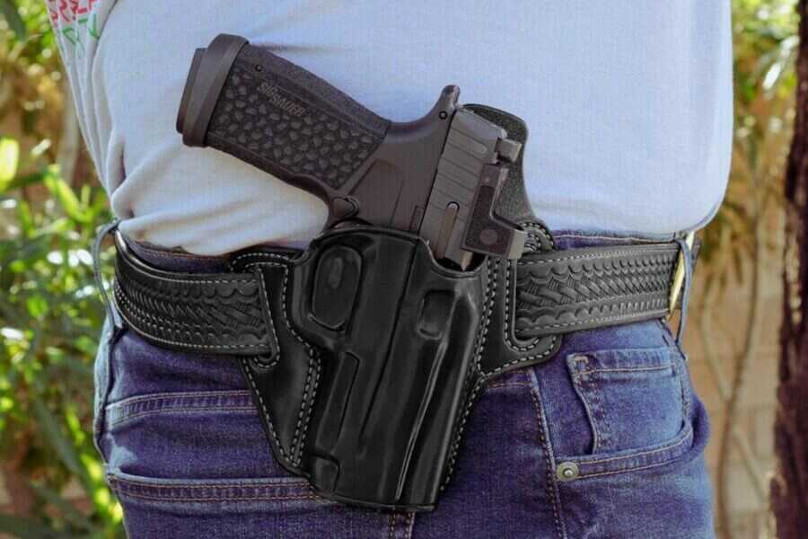 A holstered P365 Fuse on a man's waist.