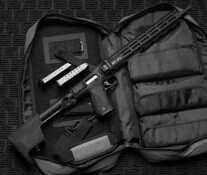 A M&P FPC in 10mm splayed out over a bag.