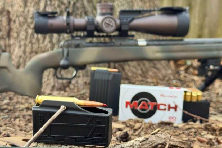 loaded 3-round MDT magazine on ground in front of Hornady Match ammo box and rifle
