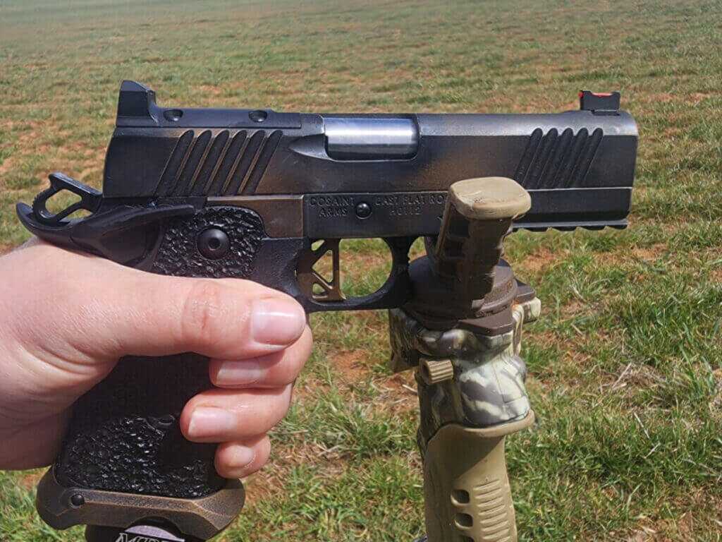 handgun on shooting sticks