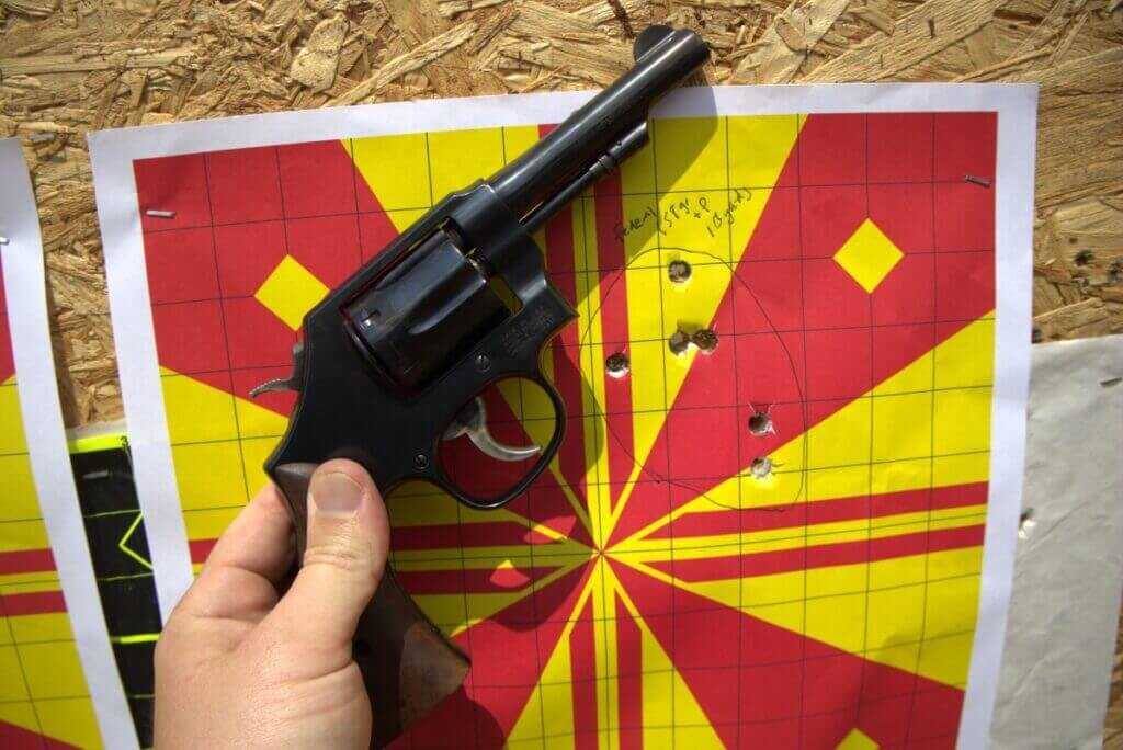 Revolver with red and yellow paper target