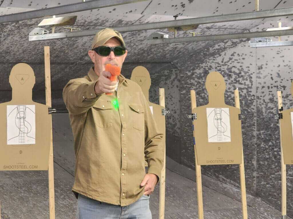 firearms instructor with dummy gun
