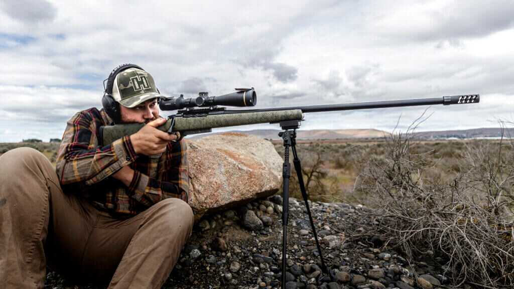 man and a rifle outdoors