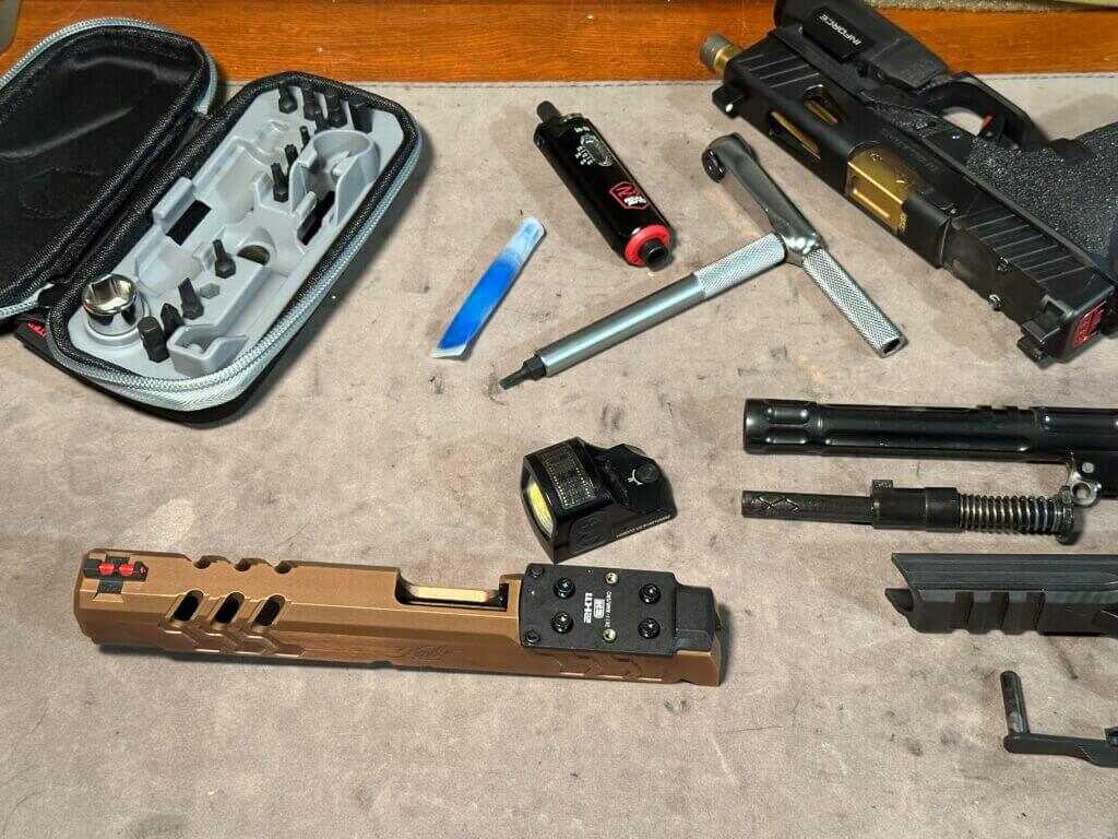 A disassembled 2011 sits on a workbench.