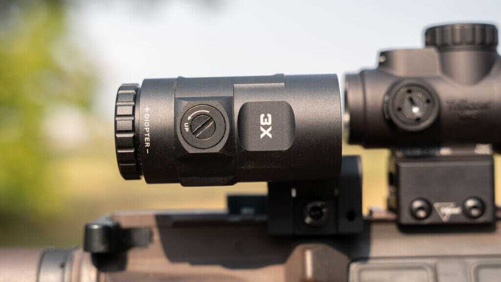 Trijicon MRO SD with 3x magnifier on rifle showing flip to side mount