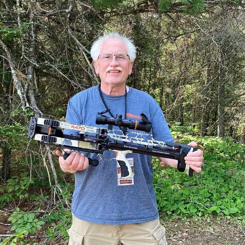 Author holding Ravin R470 crossbow he assembled during factory event