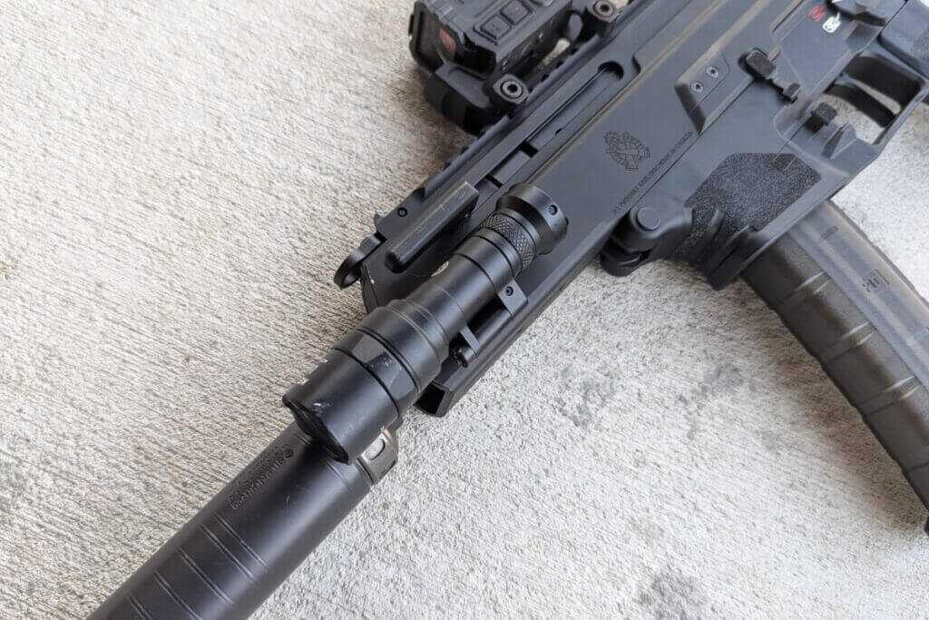 Compact pistol-caliber carbine with small weapon light attached