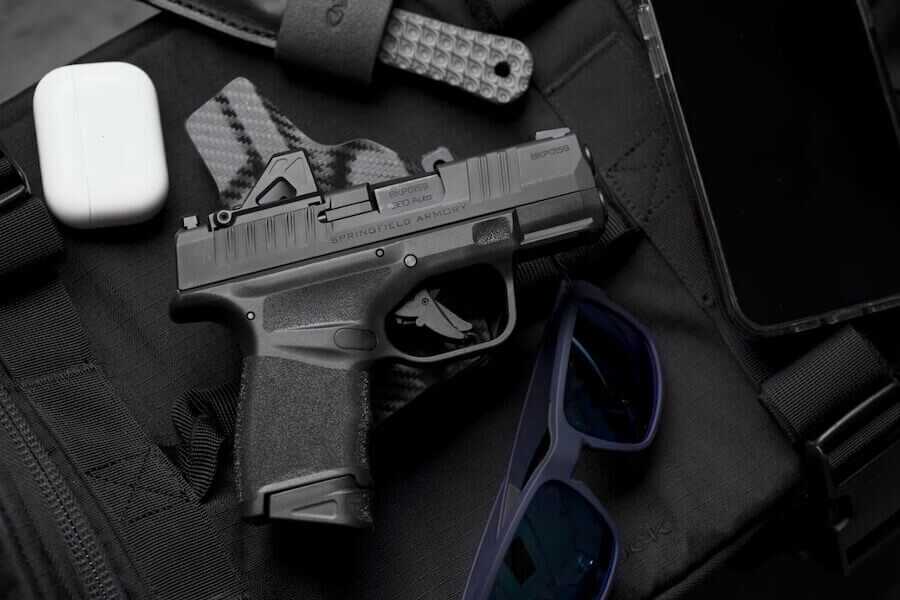 Springfield Armory's Hellcat in 380 splayed out on a table.