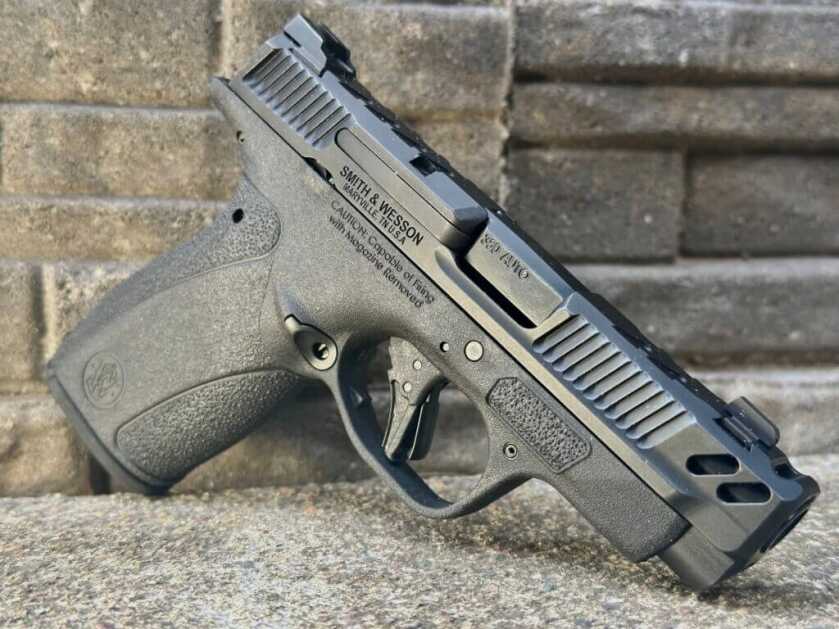 Close view of S&W Performance Center Bodyguard 2.0 Carry Comp .380 on stone background